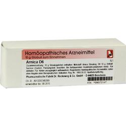 Eine weiße Verpackung von Arnica D6 Globuli, einem homöopathischen Arzneimittel.